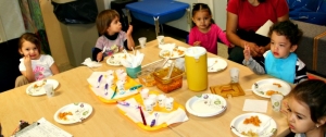 Westside Head Start children enjoying snack time