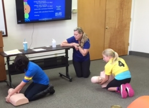 Students learn CPR at Safe Sitter class.