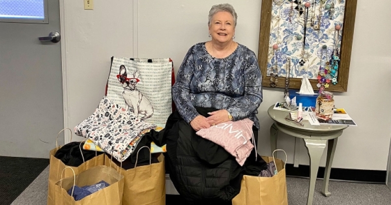 Nan DeChant with Teens&#039; Closet donations.