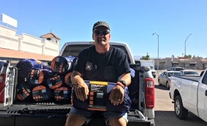 Catholic Charities volunteer Steve Bristyan with donated sleeping bags.